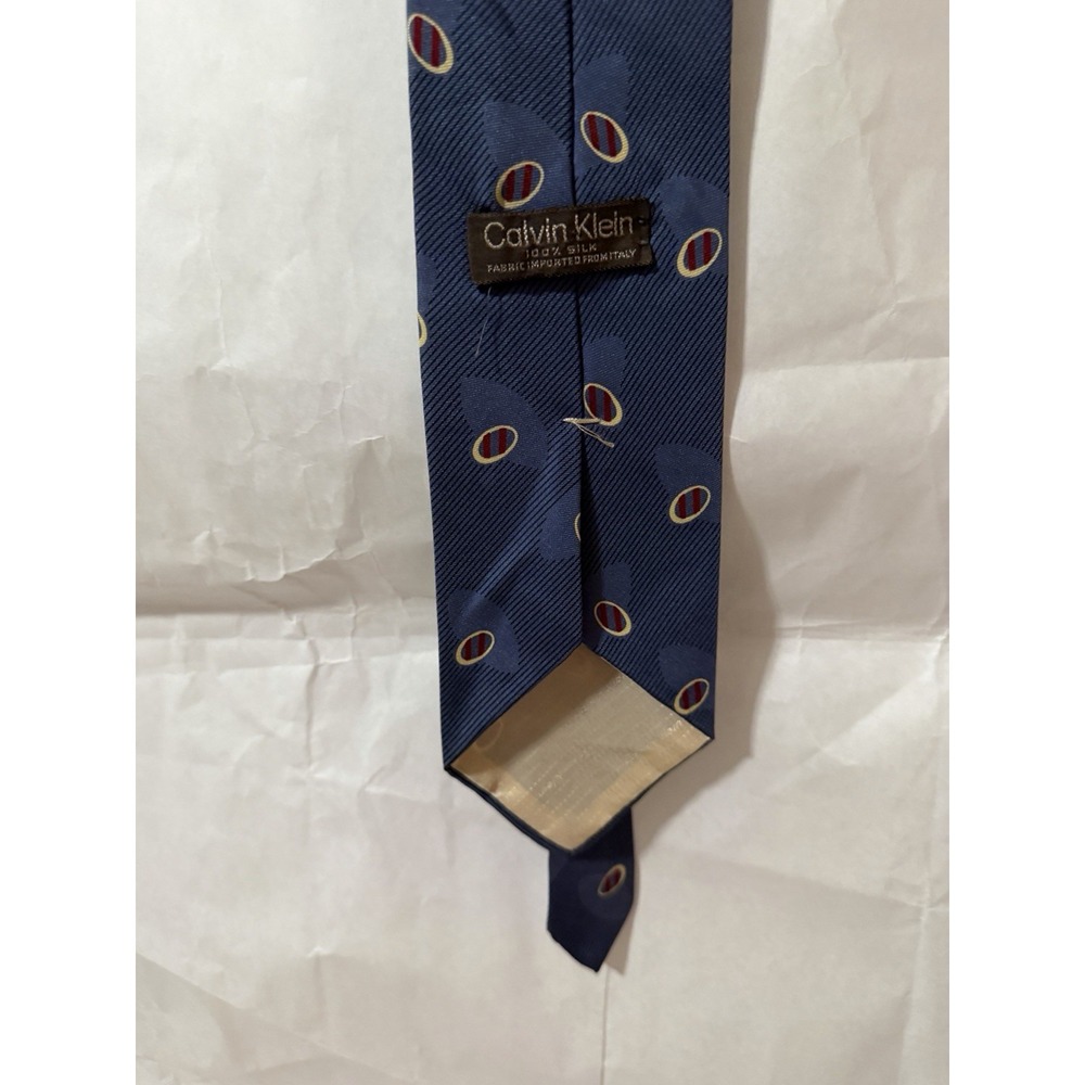 Calvin Klein 100% silk necktie featuring a textured diagonal pattern